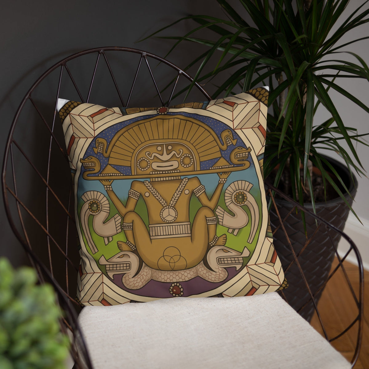 Throw pillow featuring my hand-drawn Colombian sun god artwork, styled in a living room