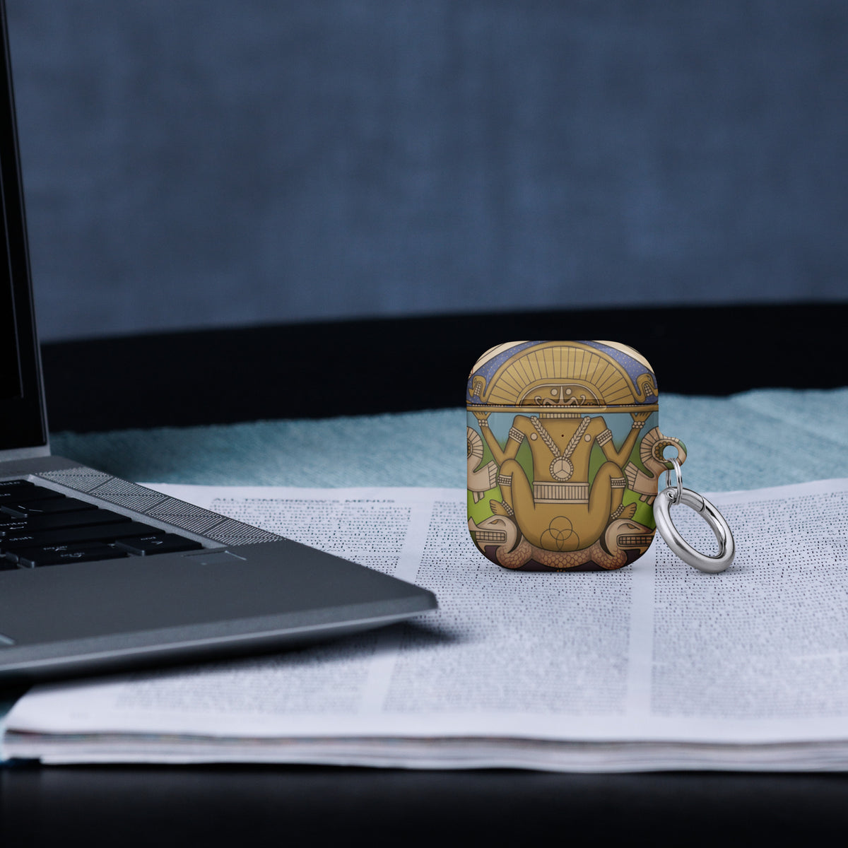 White AirPods case (2nd generation) with hand-drawn pre-Columbian Sun God deity art by Bareta Fina Designs