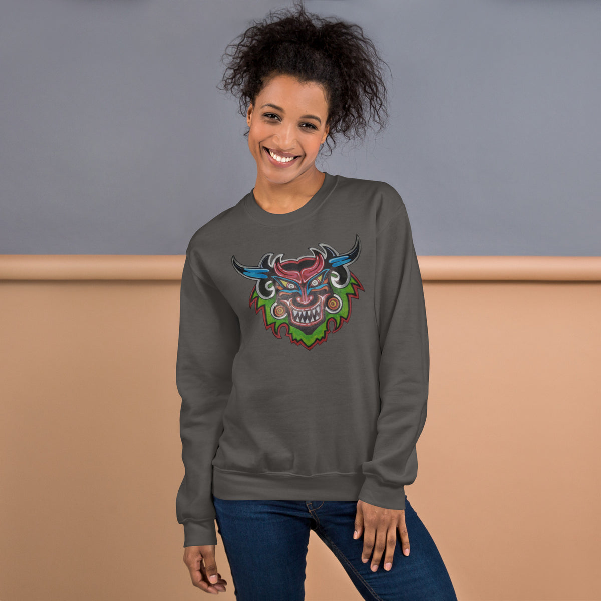 Charcoal unisex crewneck sweatshirt with hand-drawn Dancing Demon folk art by Bareta Fina Designs