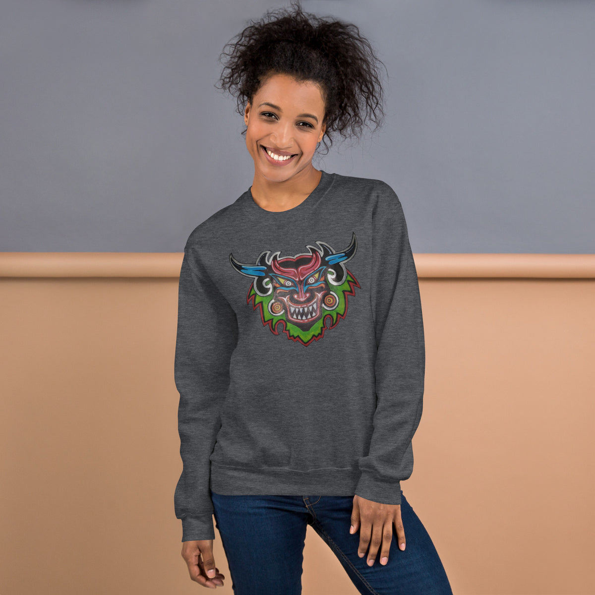 Dark heather gray unisex crewneck sweatshirt with hand-drawn Dancing Demon folk art by Bareta Fina Designs