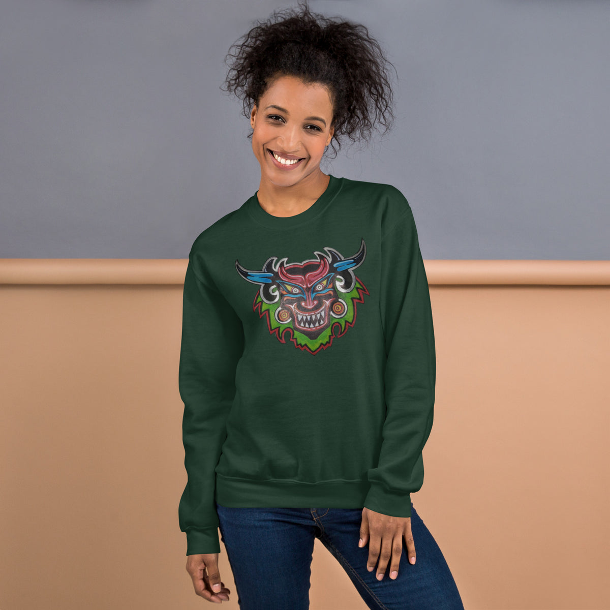 Forest green unisex crewneck sweatshirt with hand-drawn Dancing Demon folk art by Bareta Fina Designs