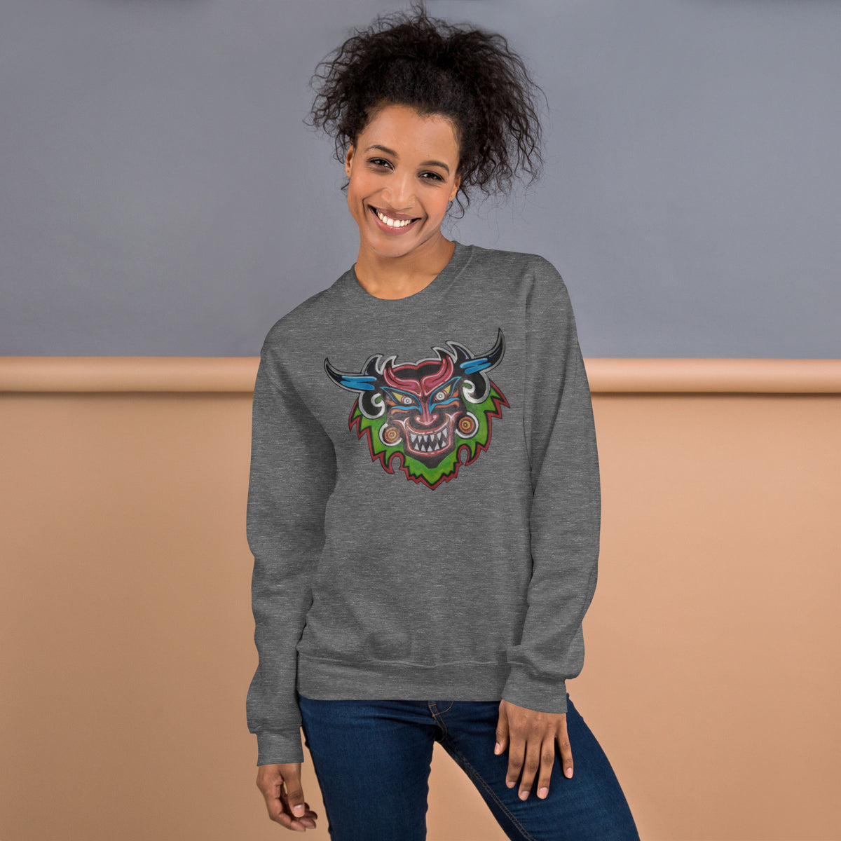 Graphite heather gray unisex crewneck sweatshirt with hand-drawn Dancing Demon folk art by Bareta Fina Designs