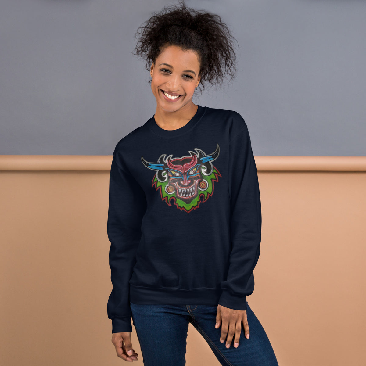 Navy unisex crewneck sweatshirt with hand-drawn Dancing Demon folk art by Bareta Fina Designs