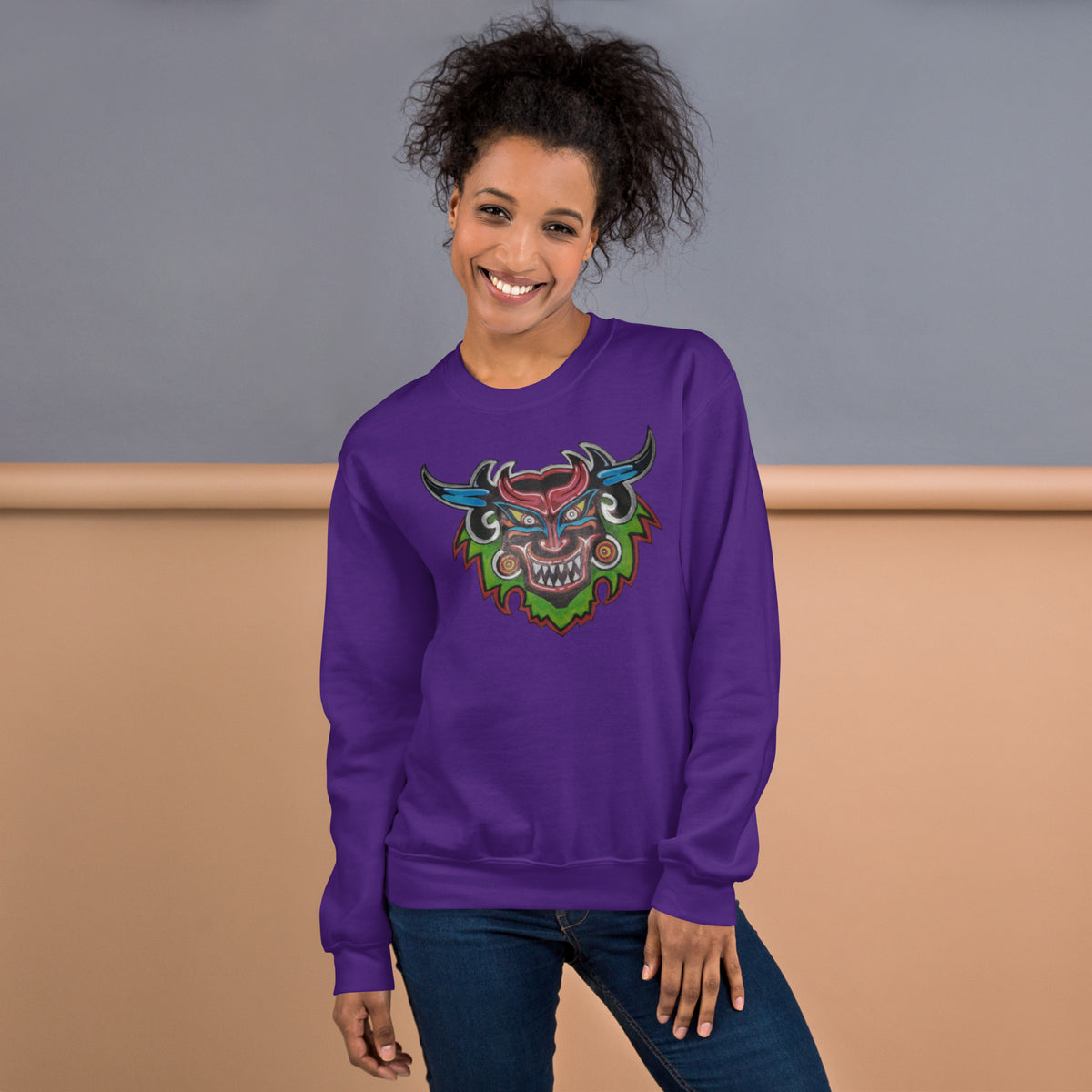 Purple unisex crewneck sweatshirt with hand-drawn Dancing Demon folk art by Bareta Fina Designs
