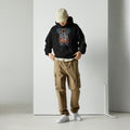 Black unisex hoodie with hand-drawn Simón Bolívar-inspired art – El Libertador hoodie by Bareta Fina Designs