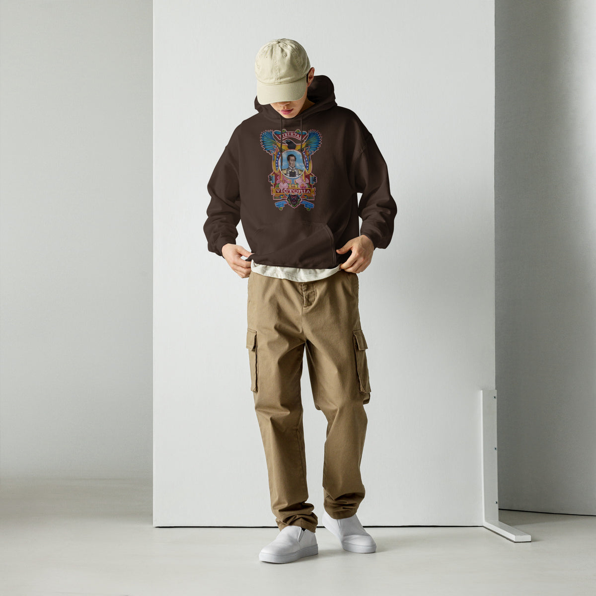 Dark chocolate unisex hoodie with hand-drawn Simón Bolívar-inspired art – El Libertador hoodie by Bareta Fina Designs