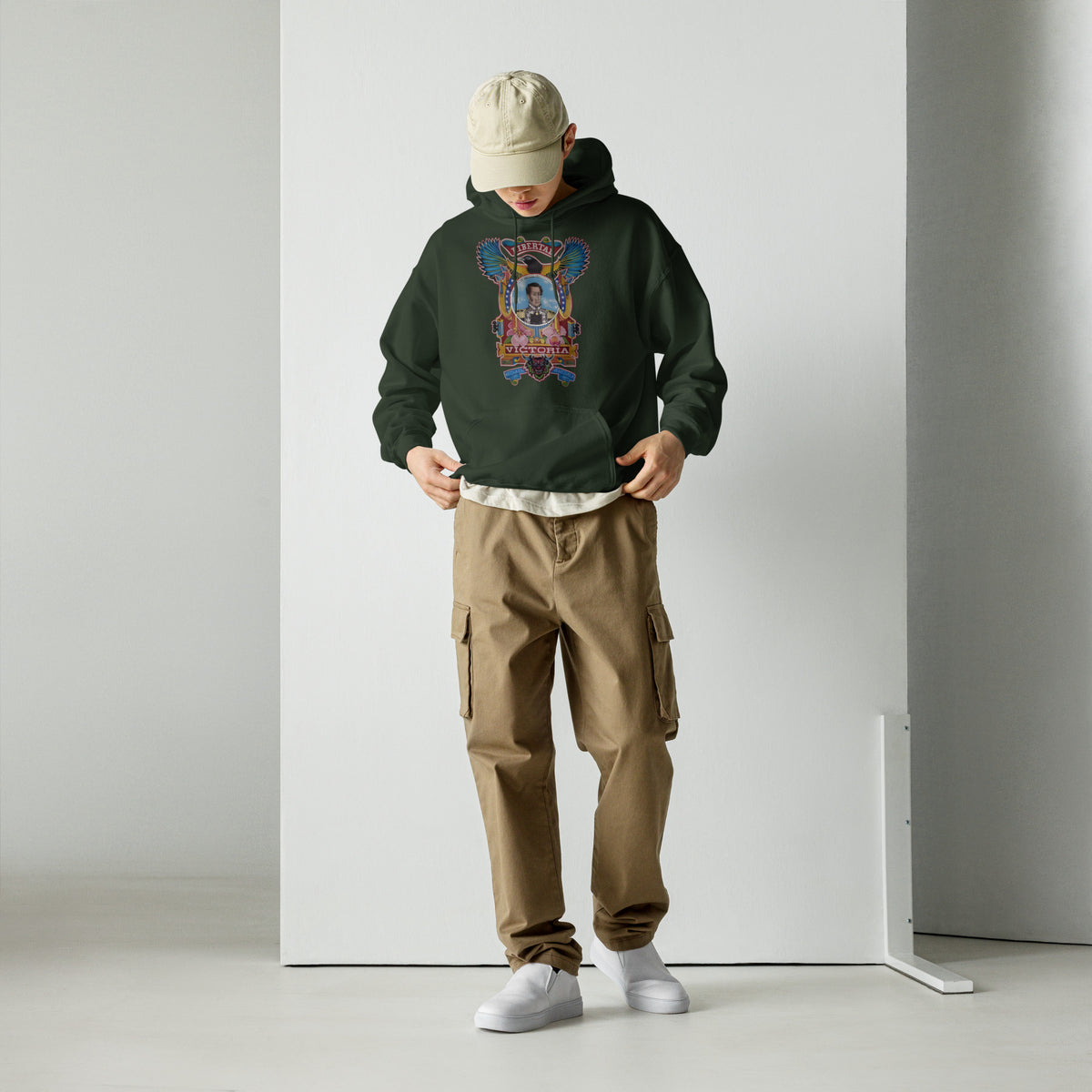 Forest green unisex hoodie with hand-drawn Simón Bolívar-inspired art – El Libertador hoodie by Bareta Fina Designs
